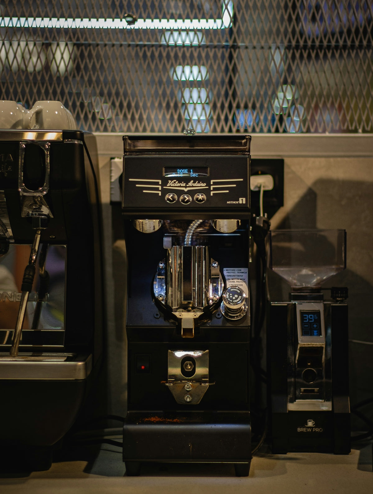 an espresso machine sitting next to a coffee maker
