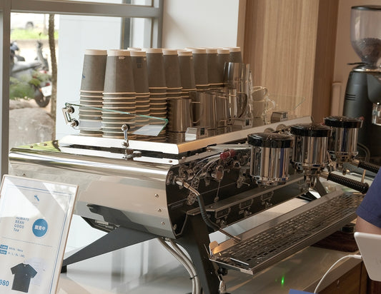 a person working on a laptop in a coffee shop