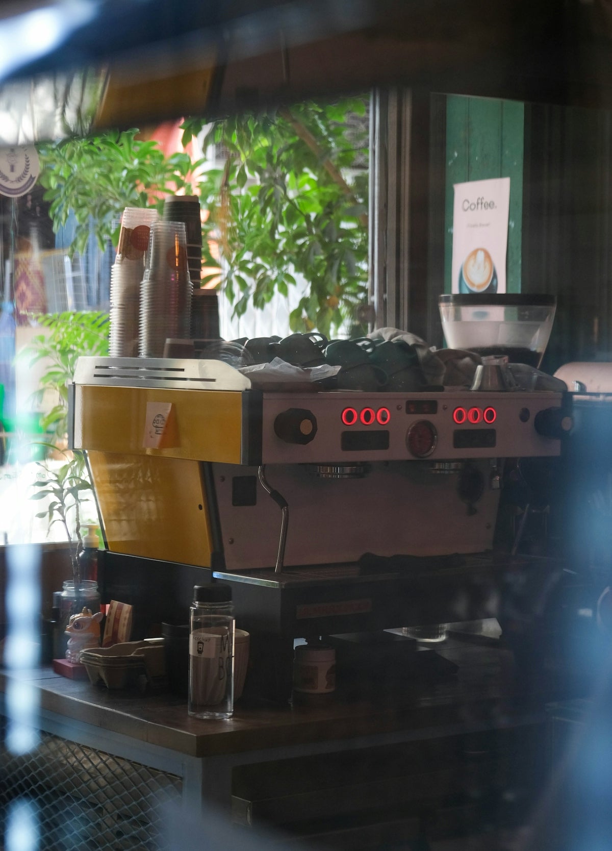 A coffee machine sitting on top of a wooden table
