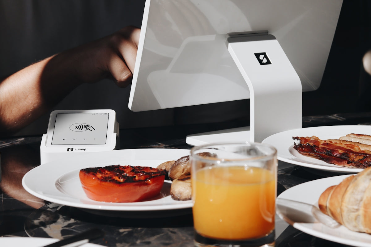 A person sitting at a table with a plate of food