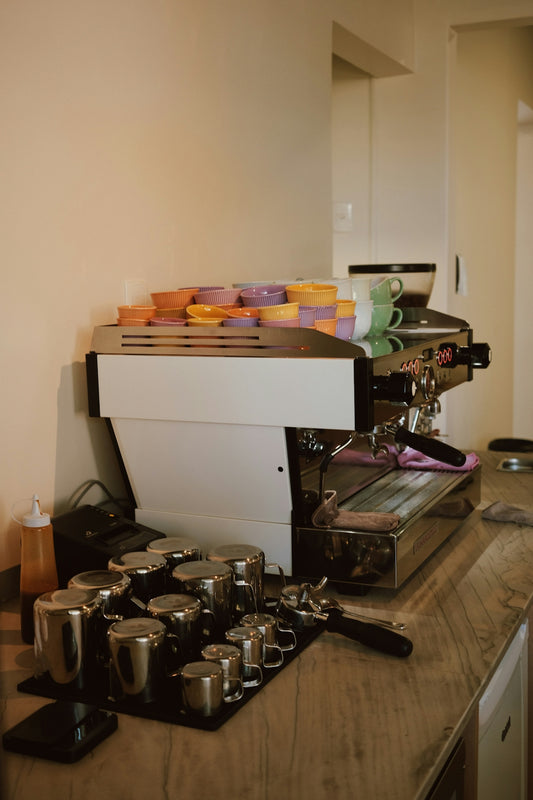 Espresso machine with cups ready for use.