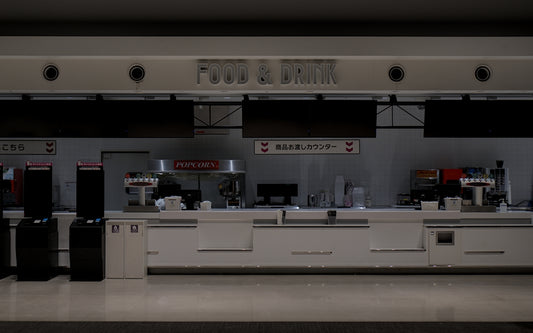 Empty airport check-in counters with luggage