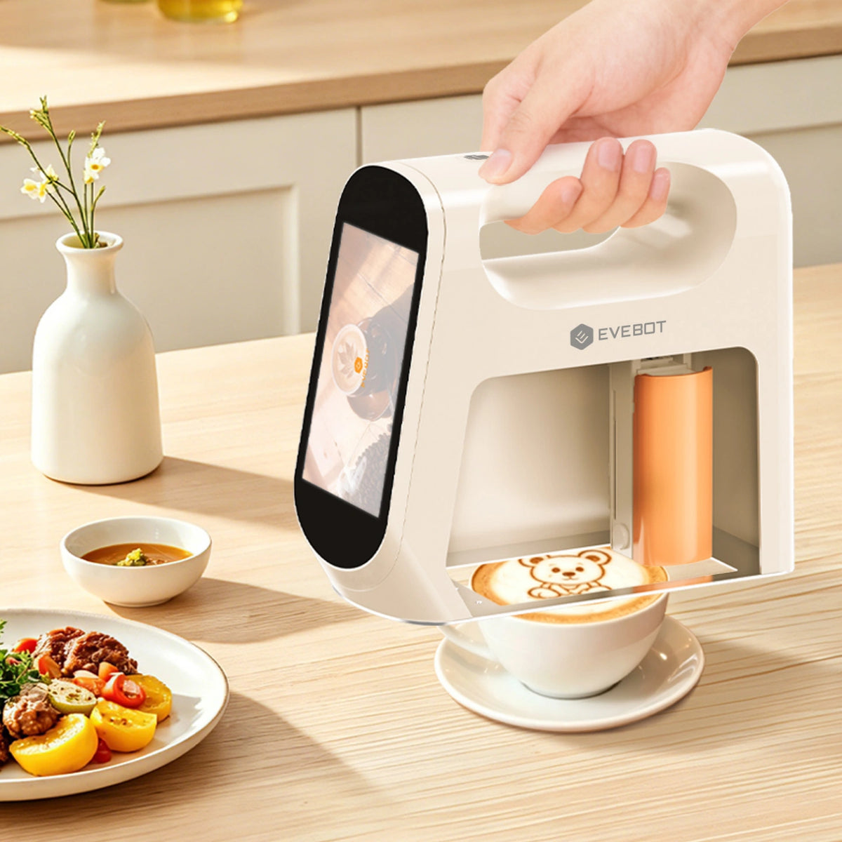 Hand using Evebot Smart portable printer to create a bear design on coffee.