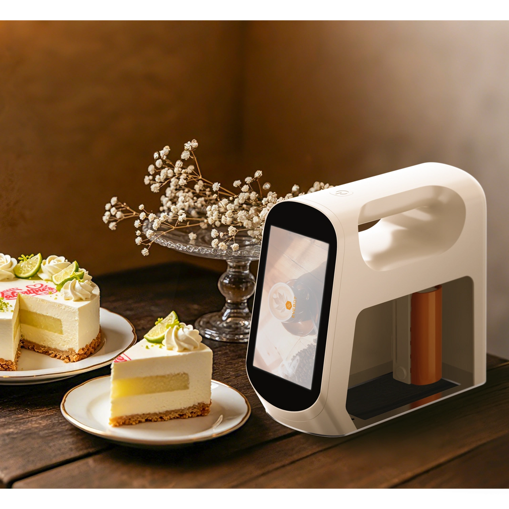 Evebot Smart edible printer next to a decorated cake, showing its application for custom edible designs.