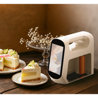 Evebot Smart edible printer next to a decorated cake, showing its application for custom edible designs.
